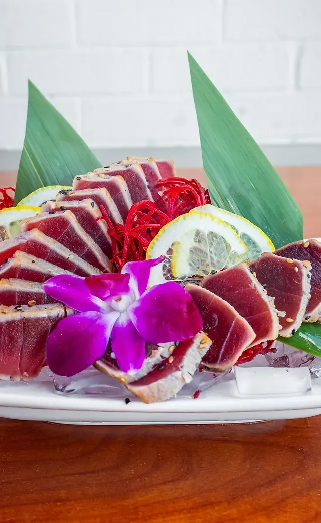 Seared ahi tuna sliced to show a rare center
