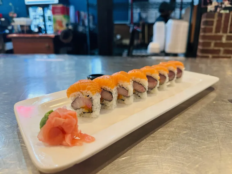 Sunset Roll at Bamboo Sushi Bar & Hibachi Express, each piece draped with a slice of fresh salmon