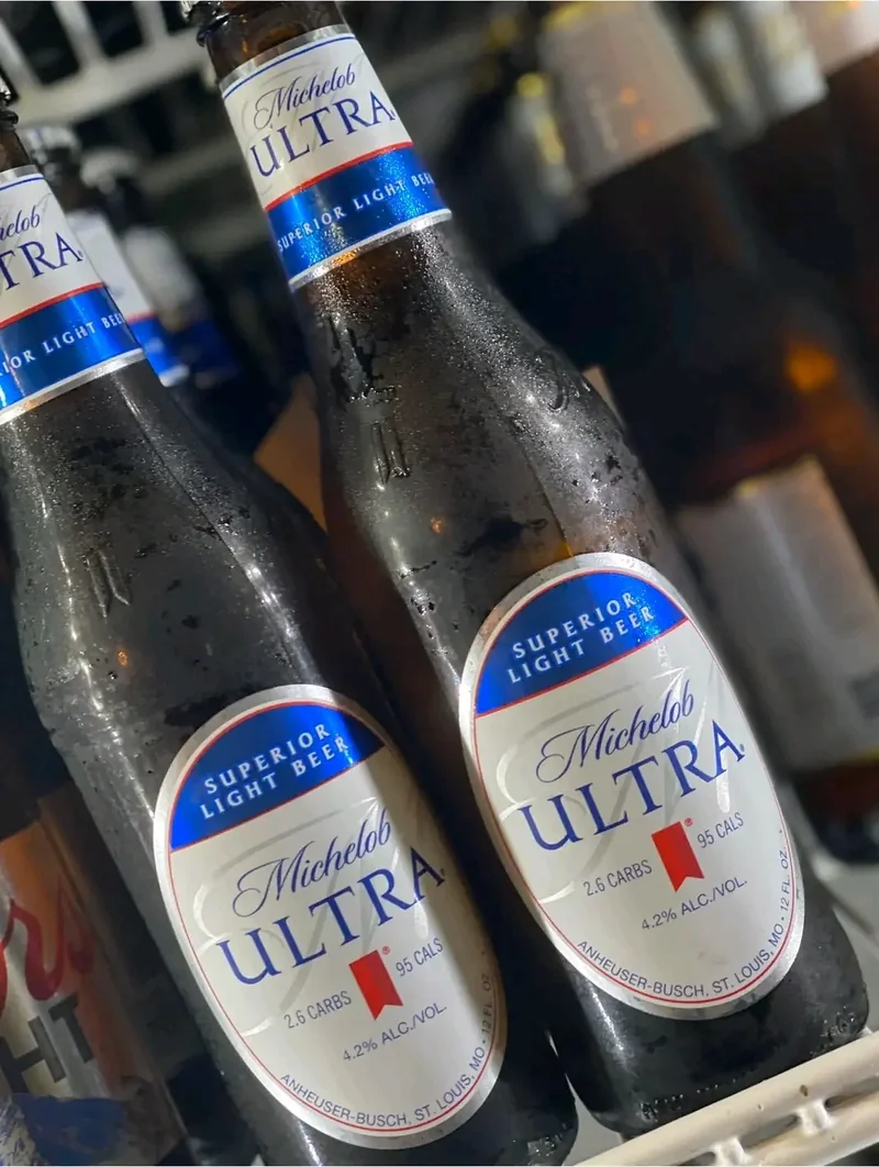 Bottled beer chilling on ice in a cooler at the bar